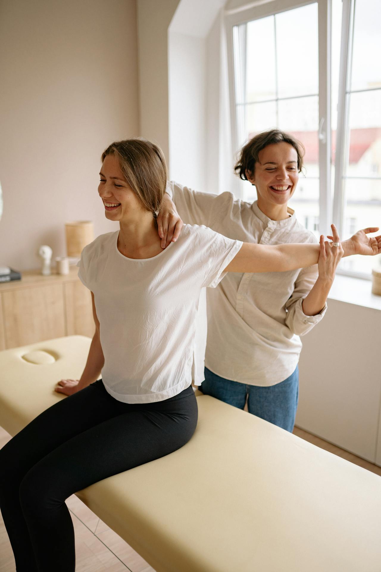 Photo by Yan Krukau: https://www.pexels.com/photo/a-woman-sitting-on-the-therapy-bed-while-stretching-her-arm-5793798/